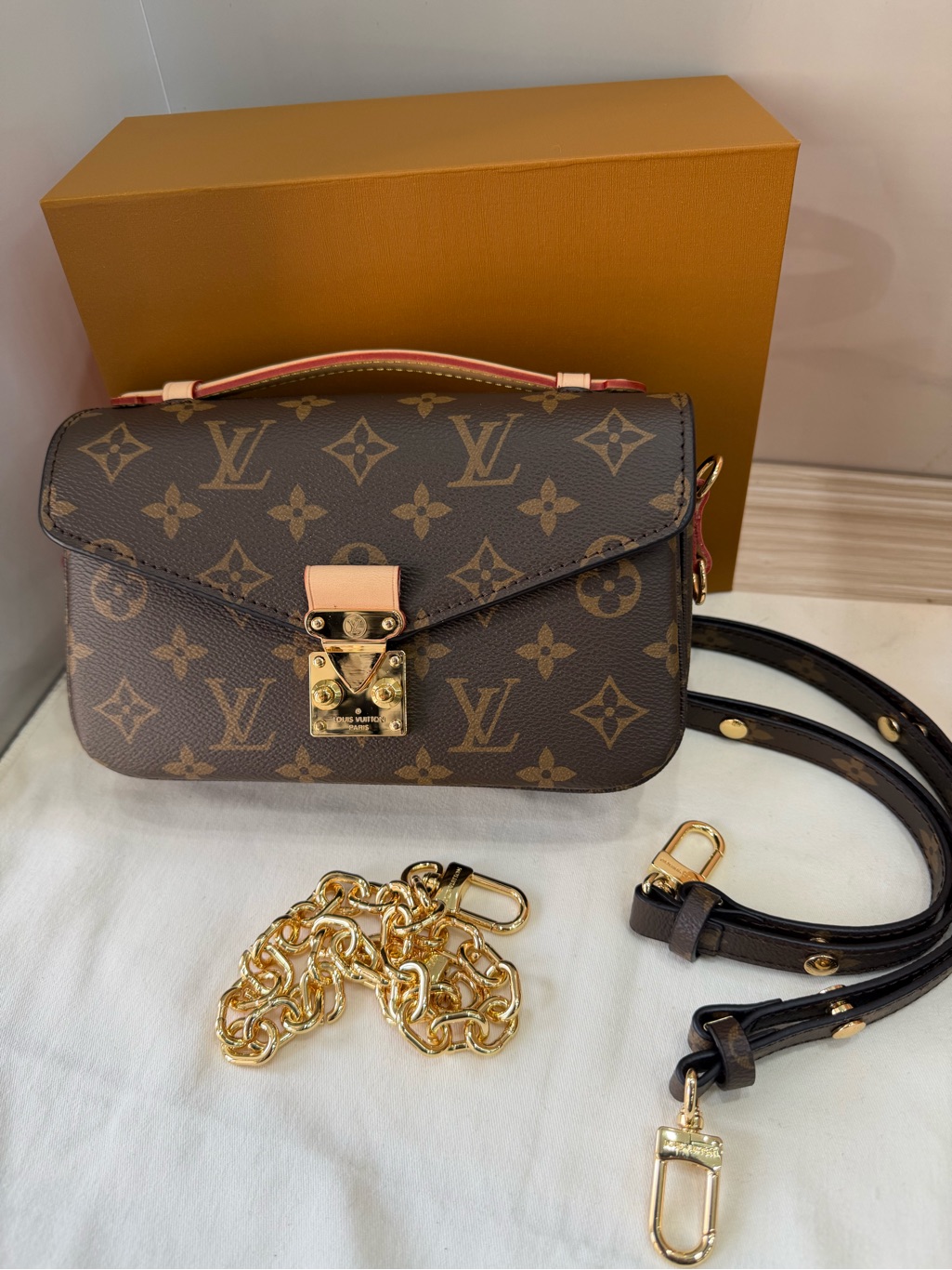 Louis Vuitton Brown Monogram Pochette With Gold Hardware And Pink Trim